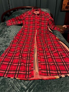Women’s pink and black snap-front duster.